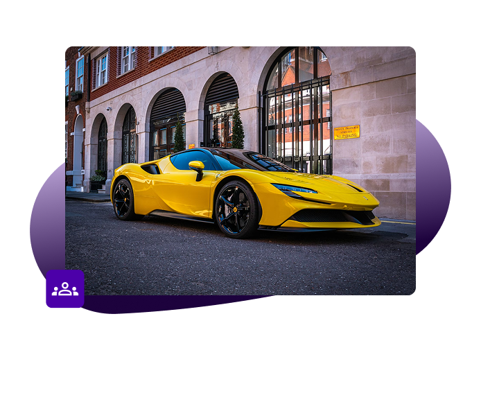 Yellow supercar on street in front of large arched windows