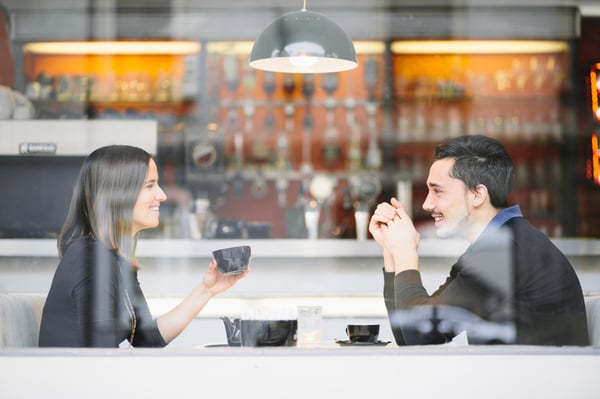 Couple_in_love_drinking_coffee_laughing_in_cafe