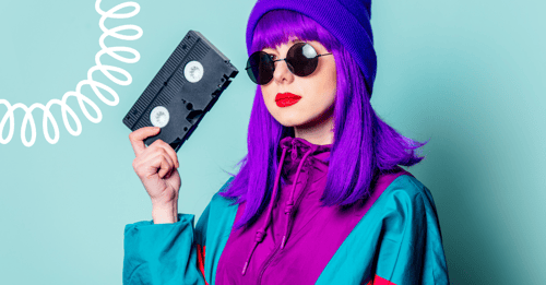 80s woman holding video cassette